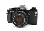 Canon AV-1 35MM Film Slr Camera W/ New Fd 50MM F/2 Lens Tested Japan. Fixed Price $149.99.